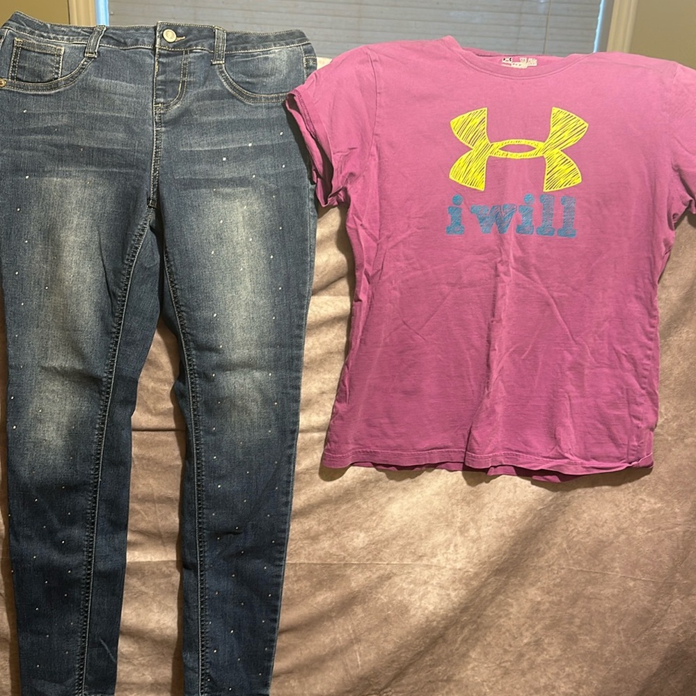 Girls shirt and pants out fit under armour t-shit and falls creek blue jeans.